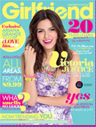 Girlfriend Magazine Cover – Featuring Victoria Justice and Fashion Trends A Girlfriend magazine cover featuring Victoria Justice in a purple floral dress, smiling brightly. The cover includes headlines about beauty, fashion, and celebrity news, with a focus on trending topics and youth culture.