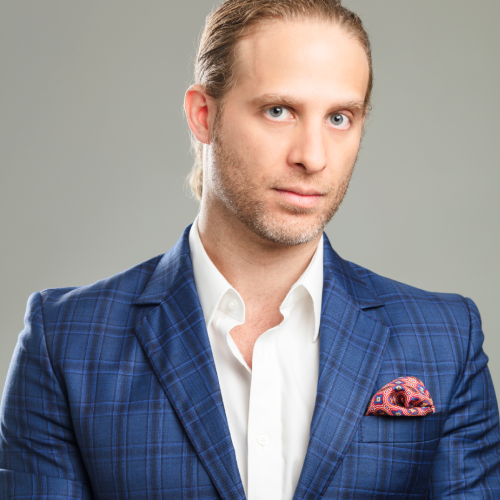 Style for Men – Sophisticated Look with a Grey Suit & Vintage Car Stylish man wearing a blue checkered blazer with a patterned pocket square and white shirt