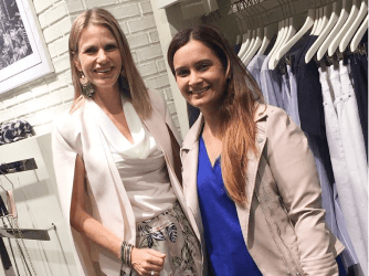 A stylist and client enjoy a personalised shopping session, exploring clothing options